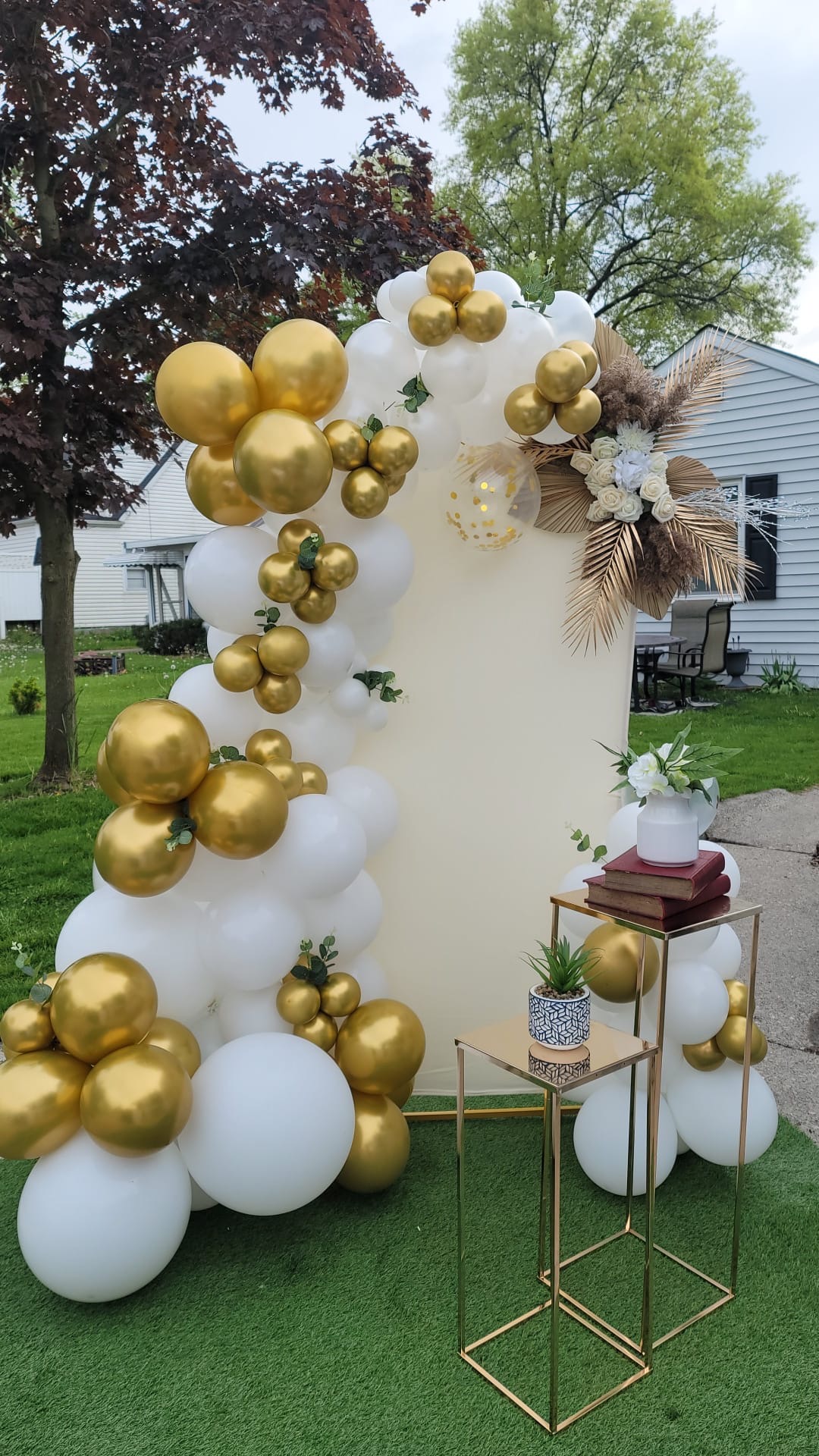 White and gold photo booth by Bella Decorations in Willard, OH